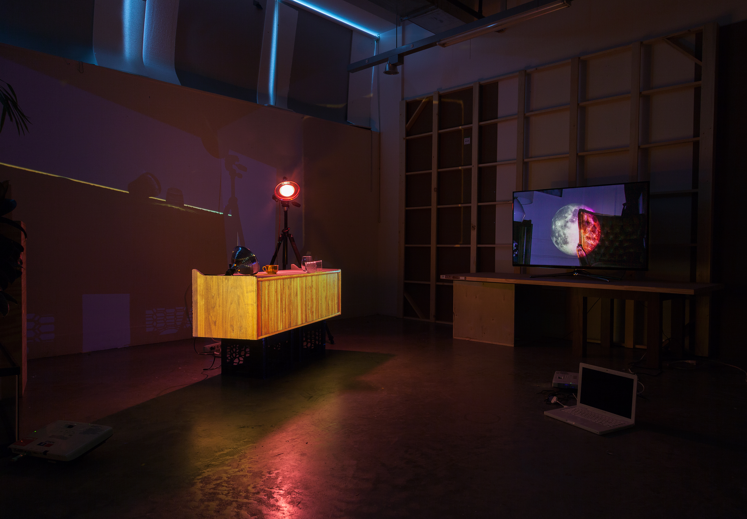 Kyle_Williams-03_UNTITLED_CONSOLE_2015_PROJECTION_ON_STYROFOAM_WITH_OBJECTS_VIEW_3_WITH_MOON_VIDEO_INSTALLED_