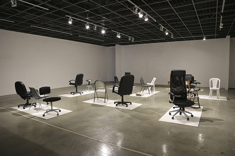 "Your Working Chair", 2015, borrowed studio chairs of some of my art colleagues, 15 chairs, 1 rocking chair, 2 stools, 1 blanket, e-mail printed, dimensions variable, CalArts-California Institute of the Arts, Valencia, CA, USA.